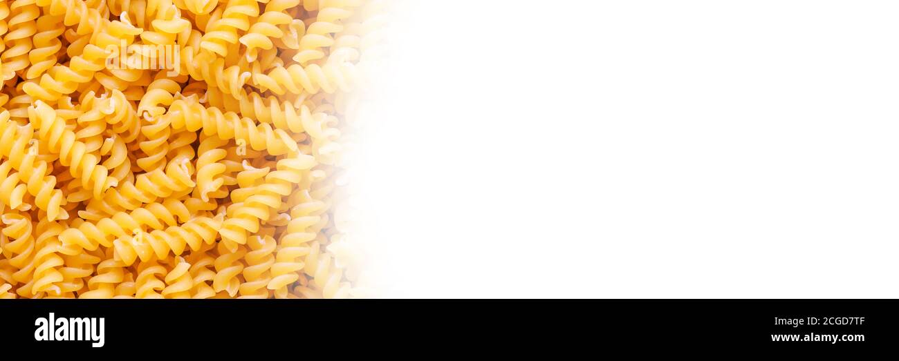Fusilli spaghetti pattern background with copy space on the right. Stock Photo