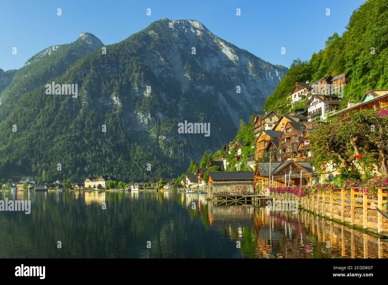 Classic postcard view of famous Hallstatt lakeside town, Austria. Scenic panoramic view of beautiful town reflecting in Hallstatter See. Stock Photo