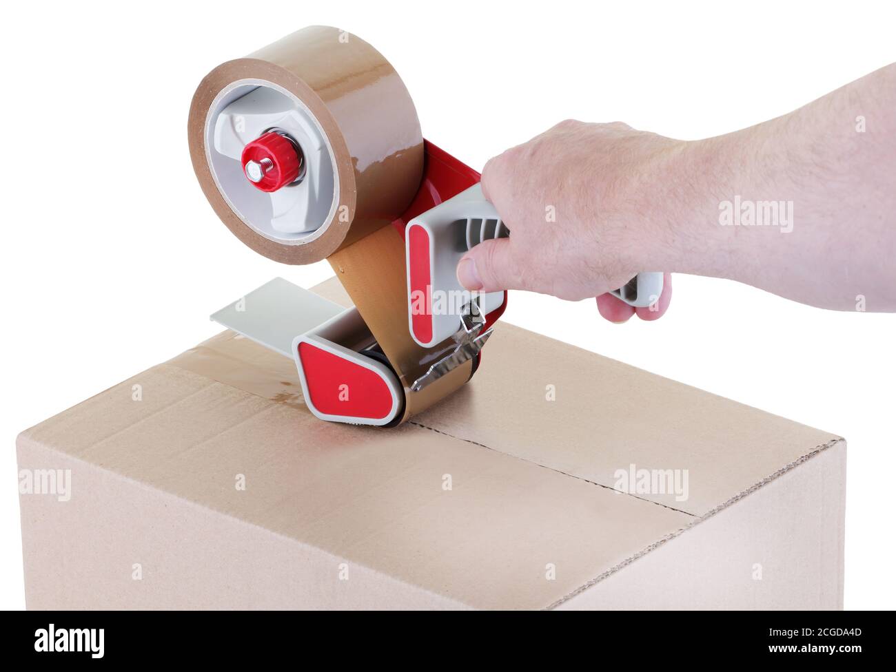 sealing a shipping cardboard box with adhesive tape dispenser Stock