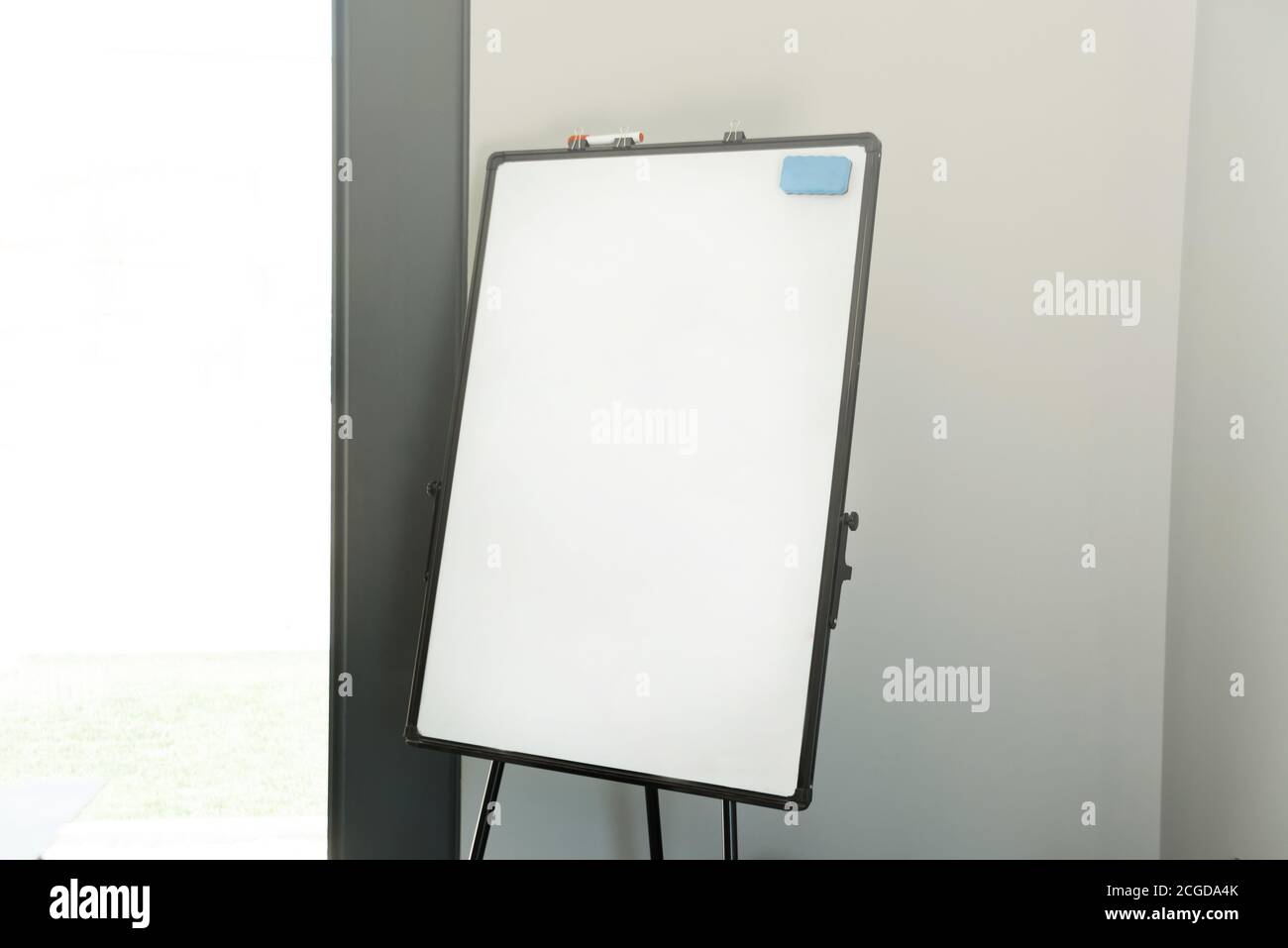 Photo of empty white board or flip chart with space for text in office. Stock Photo