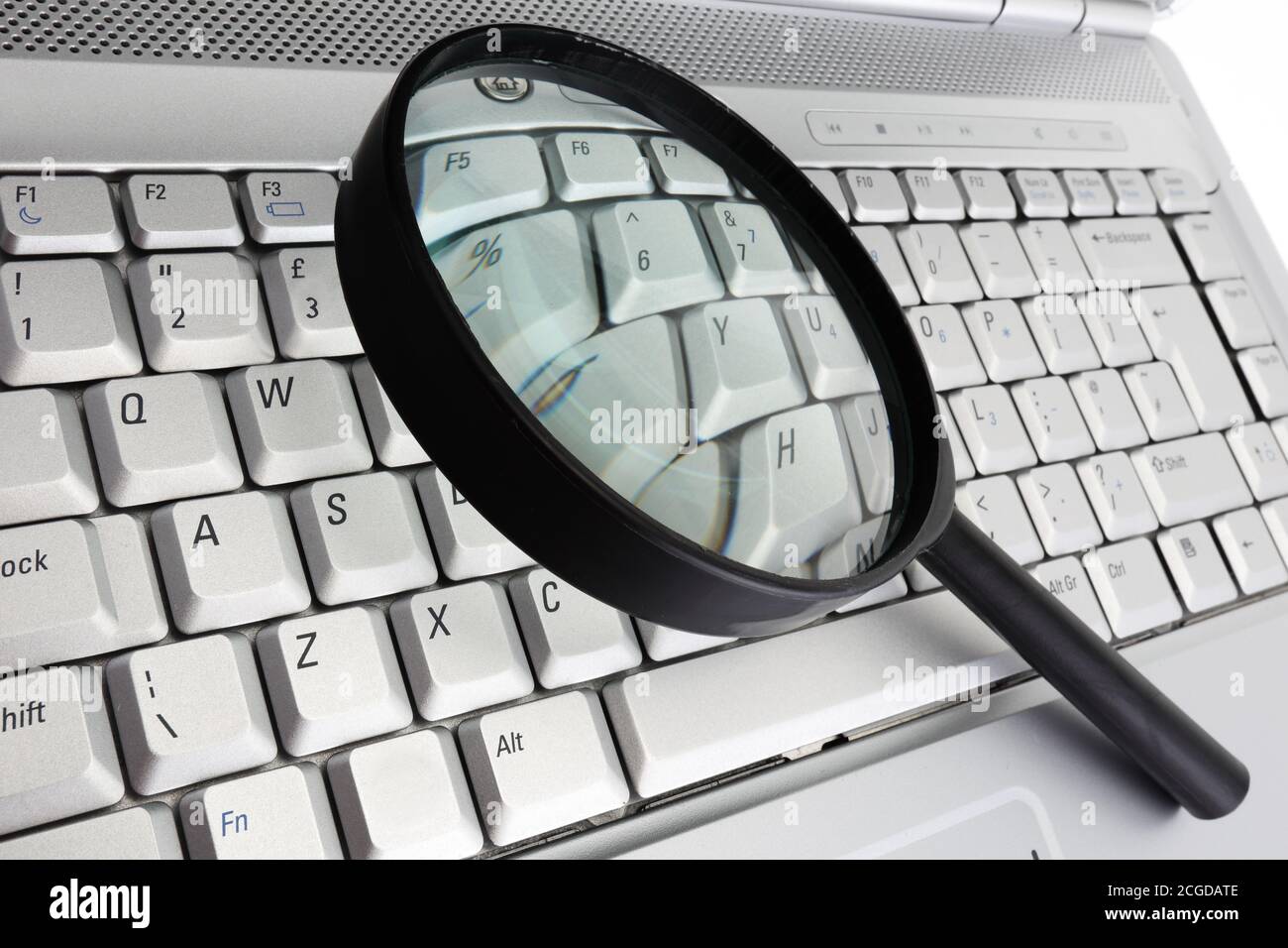 data security computer information magnifying glass concept Stock Photo