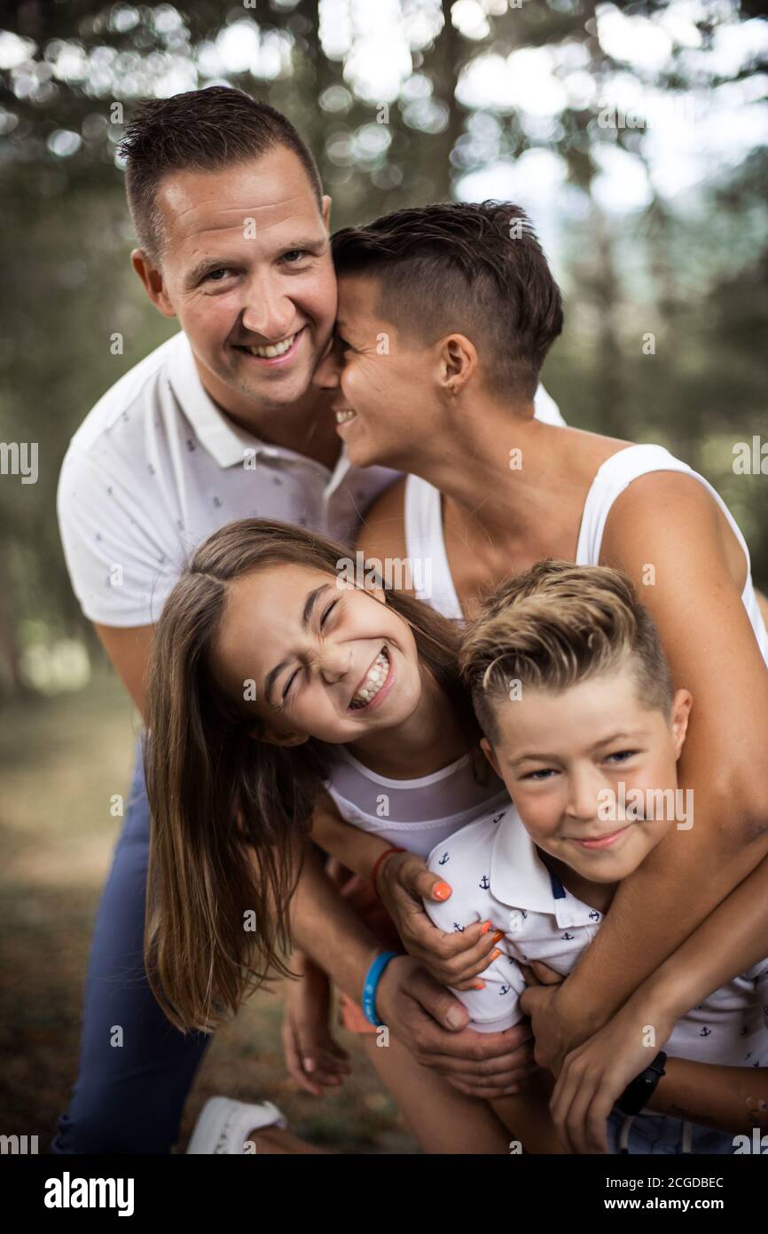 Mother, teenage daughter, brother and father having fun Stock Photo Alamy