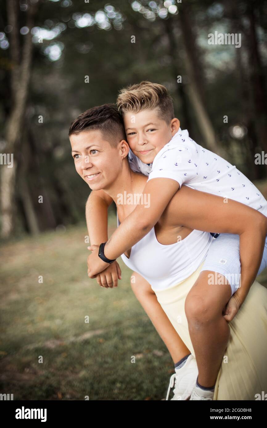 Mother and her son in the park, authentic relationship Stock Photo