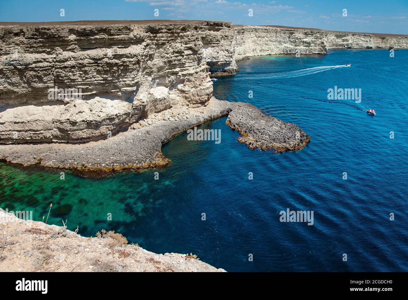 Blue sea lanscape with high stone cliff Stock Photo