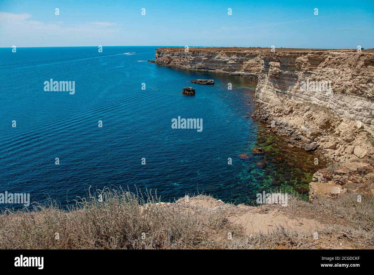 Blue sea lanscape with high stone cliff Stock Photo
