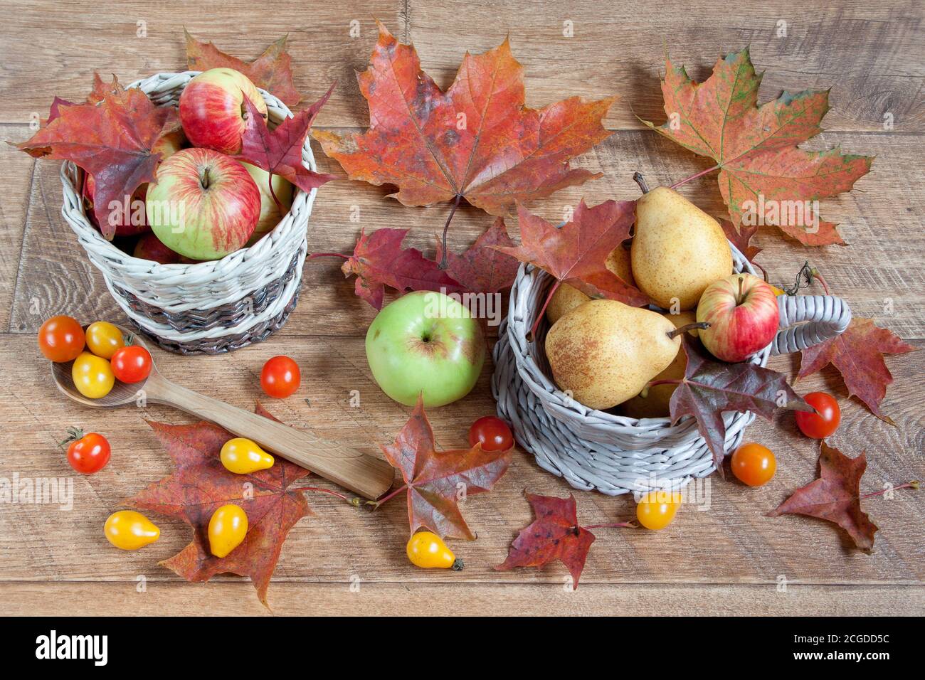 Autumn still life. Various vegetables and fruits is lying on wooden ...