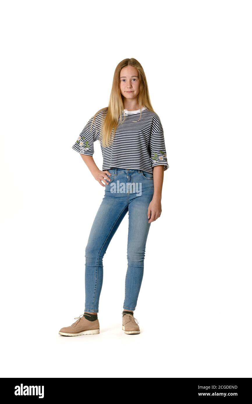 Young caucasian blonde teen girl wearing jeans and striped sweater on white  background Stock Photo - Alamy