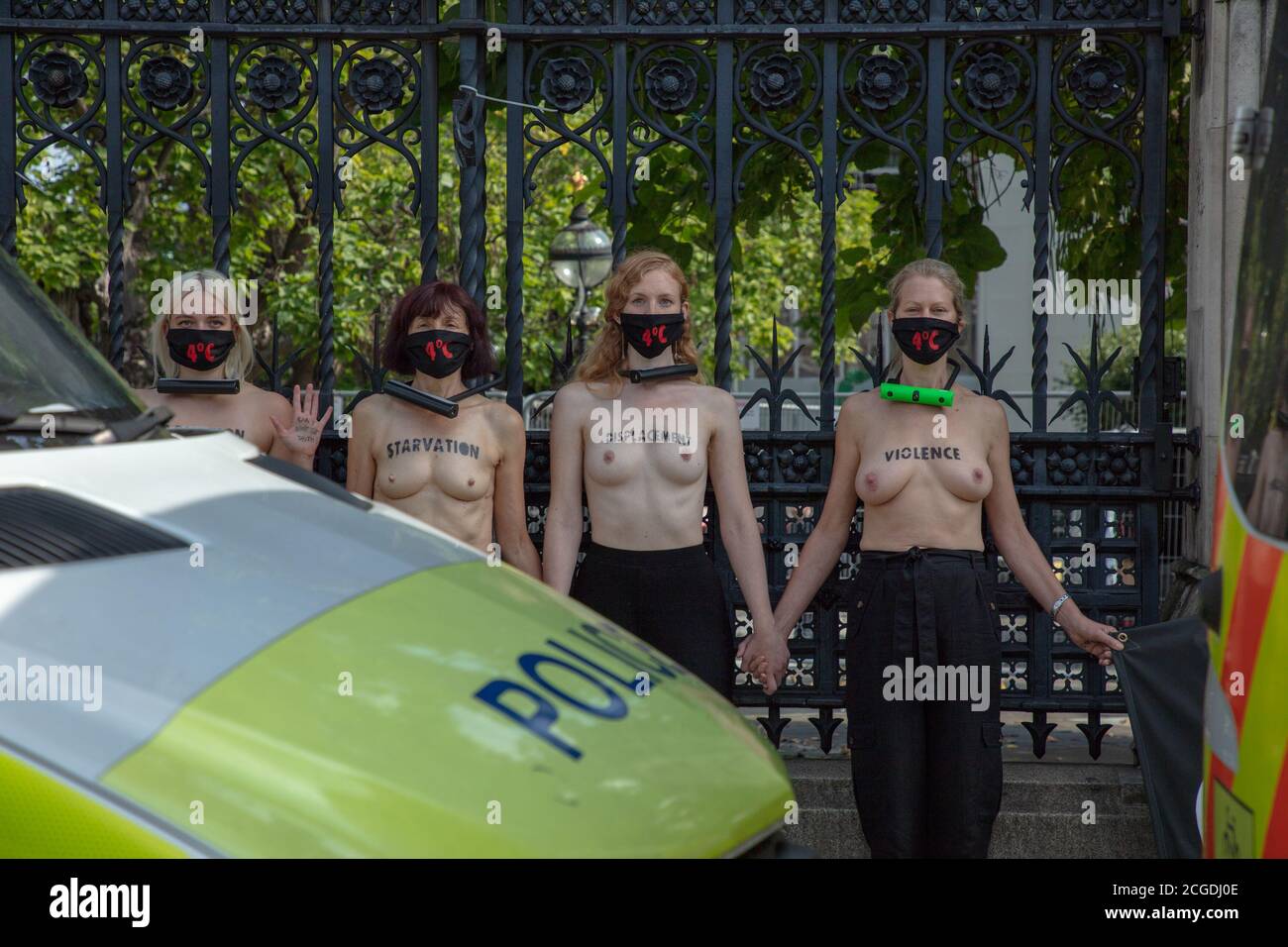 London, UK. 10th September 2020. Female members of Extinction Rebellion climate change action group seen chained to the railings of Westminster Palace. Credit: Joe Kuis / Alamy News Stock Photo