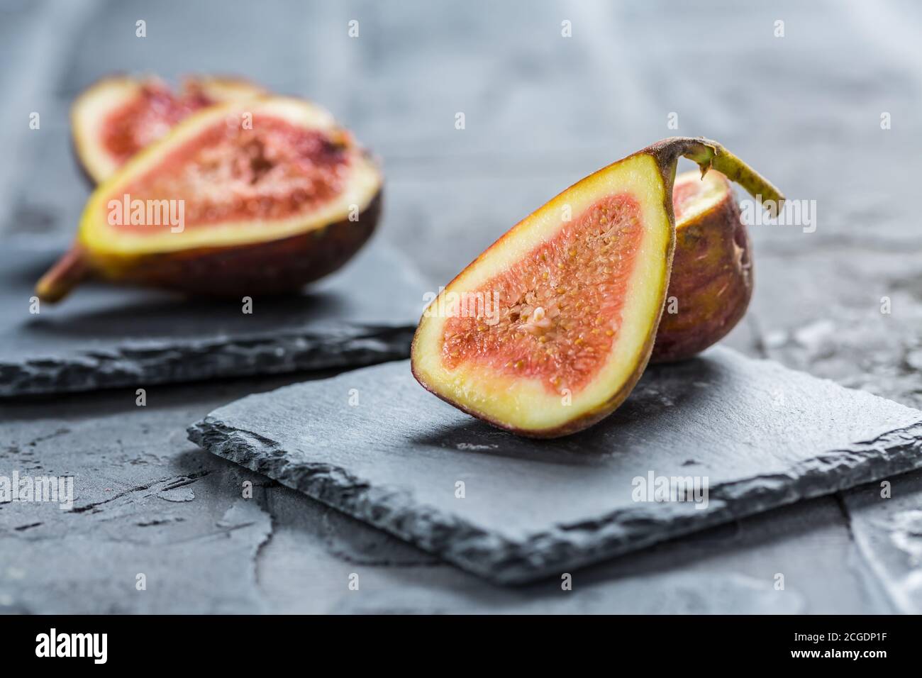 Fresh organic figs on black background Stock Photo