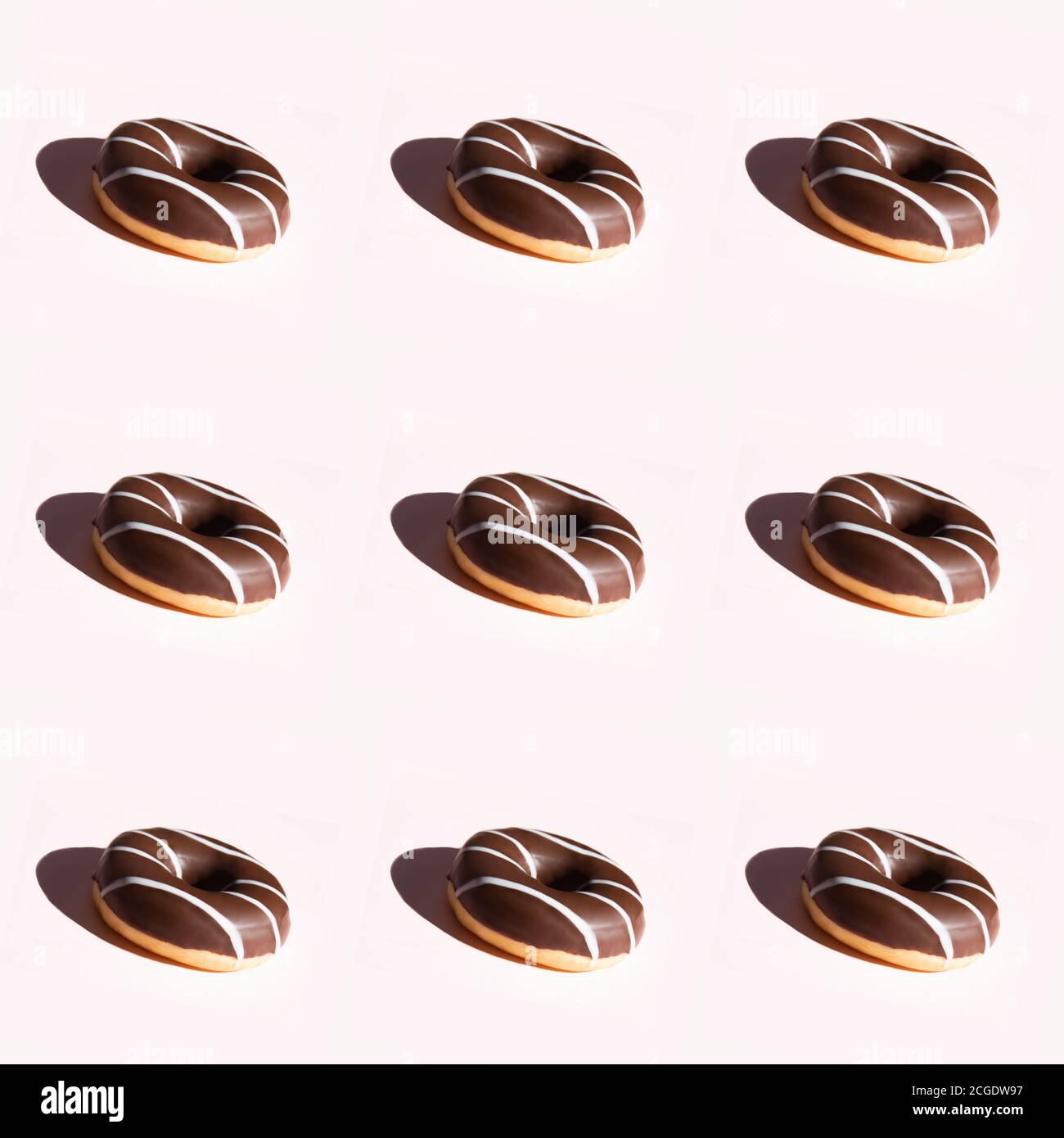 Summer pattern with chocolate donut on a light background.  Stock Photo