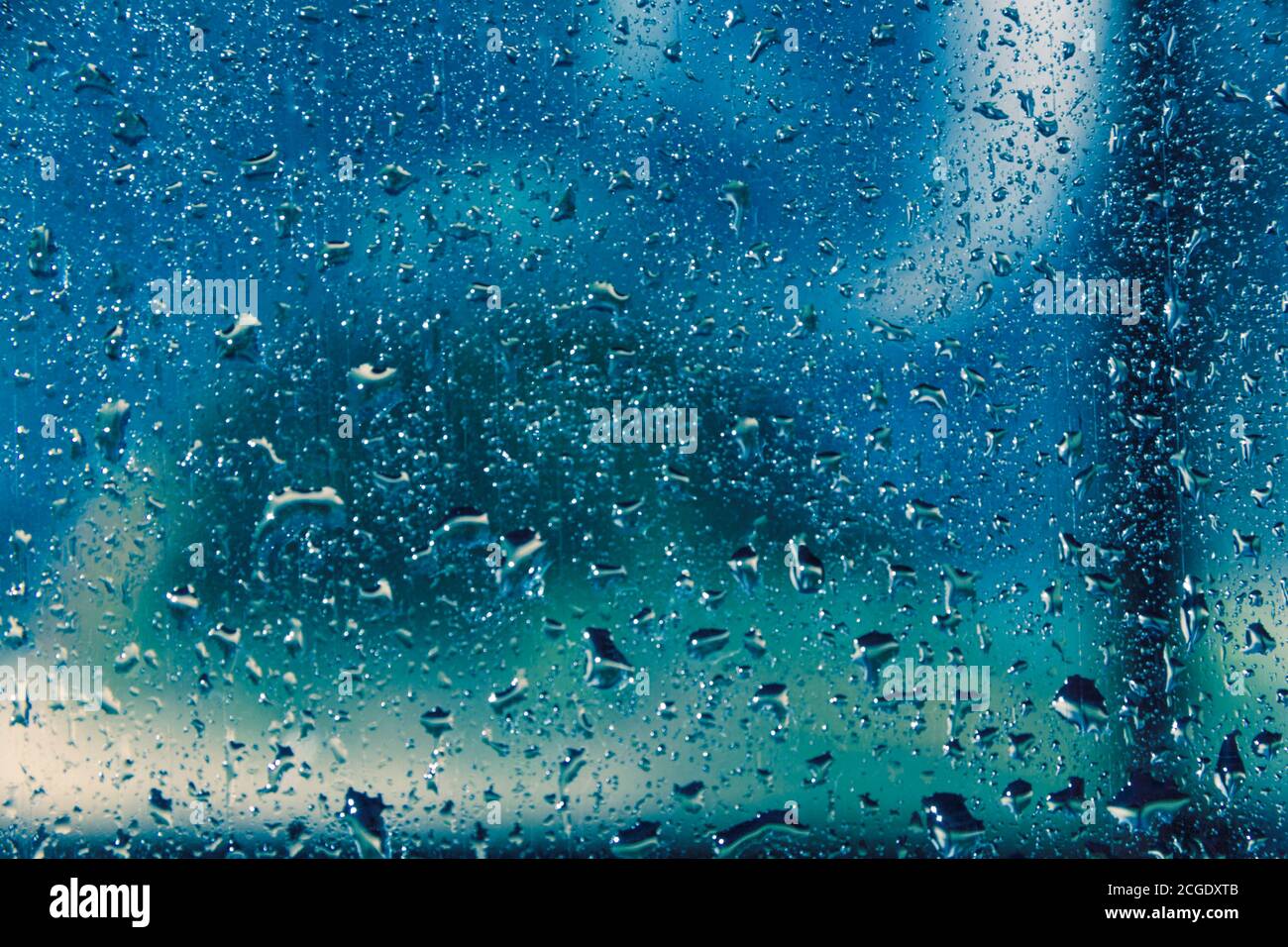 Water drops on blue background, texture. Stock Photo