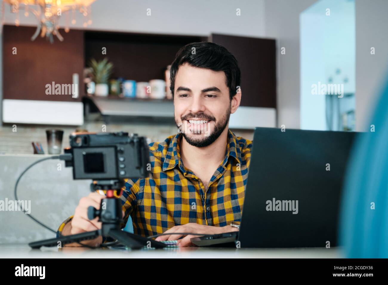 Young Man Working From Home Making Business Web Conference Stock Photo