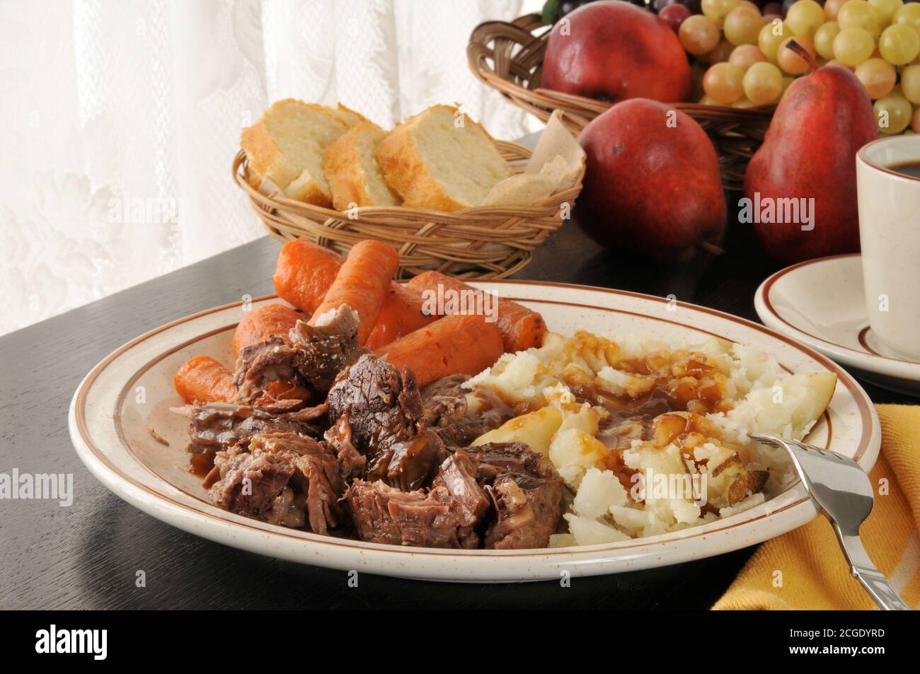 Slow roasted pot roast with potatoes and carrots Stock Photo