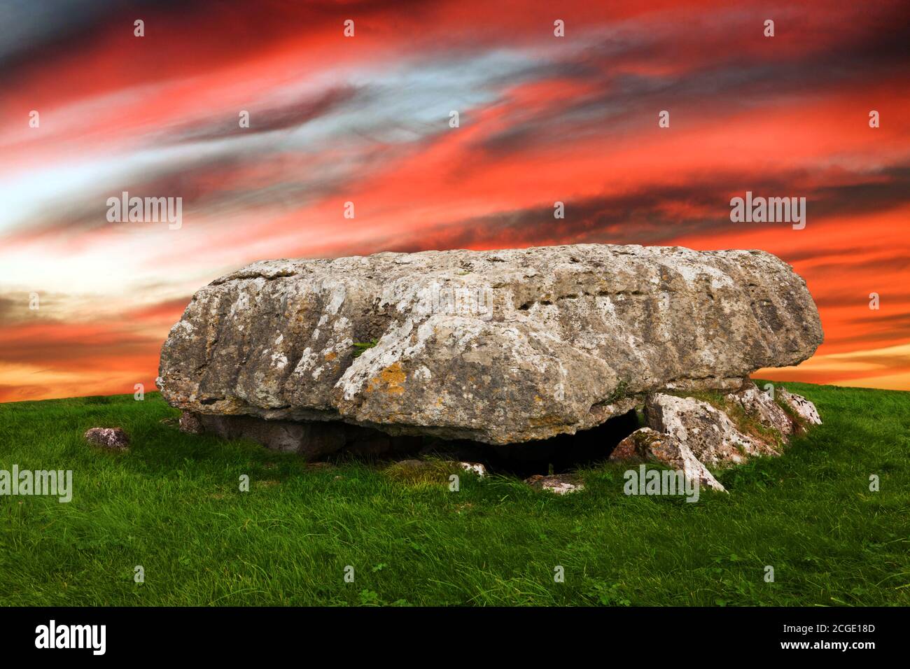 Lligwy Cromlech is a Neolithic burial chamber in Anglesey, Wales. Excavation found remains of up to 30 people. The sky and skyline has been changed. Stock Photo