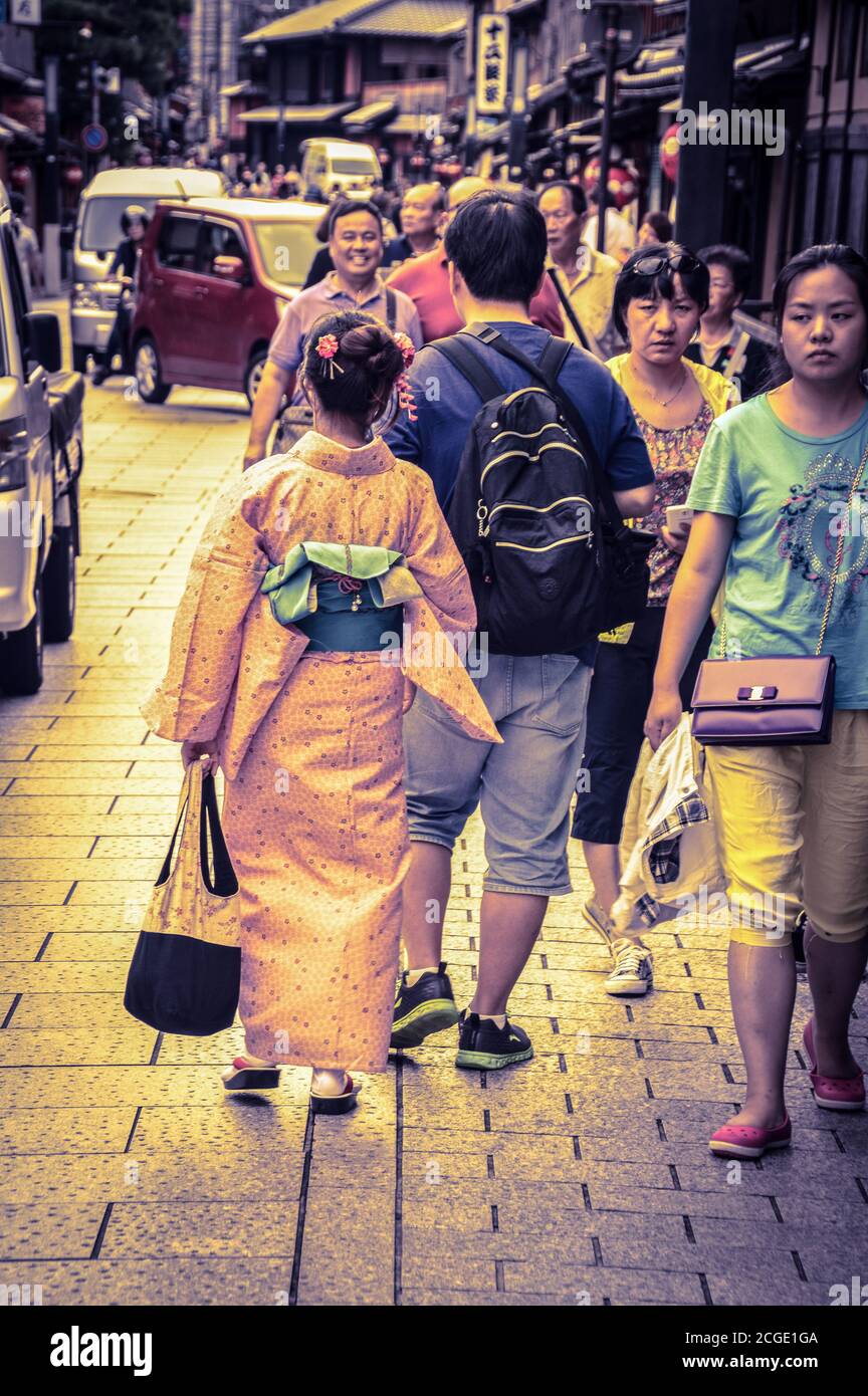 Woman In Kimono Walking At The Kyoto Streets Japan 7-9-2015 Stock Photo