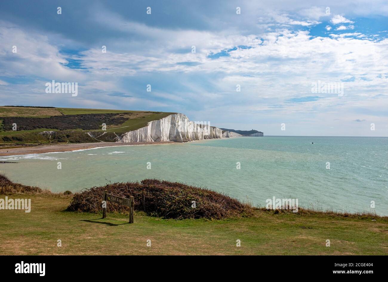 Cliff edge sign Cuckmere Haven and Seven Sisters Cliffs in East Sussex South Coast landscape Stock Photo