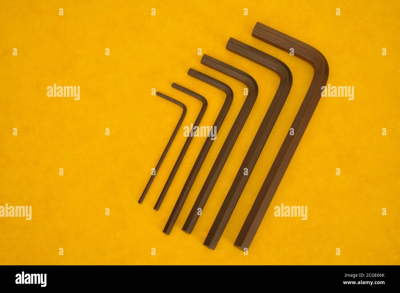 Wrenches or precision tools, six precision tools in ffoto zoom, with yellow background and copy space Stock Photo
