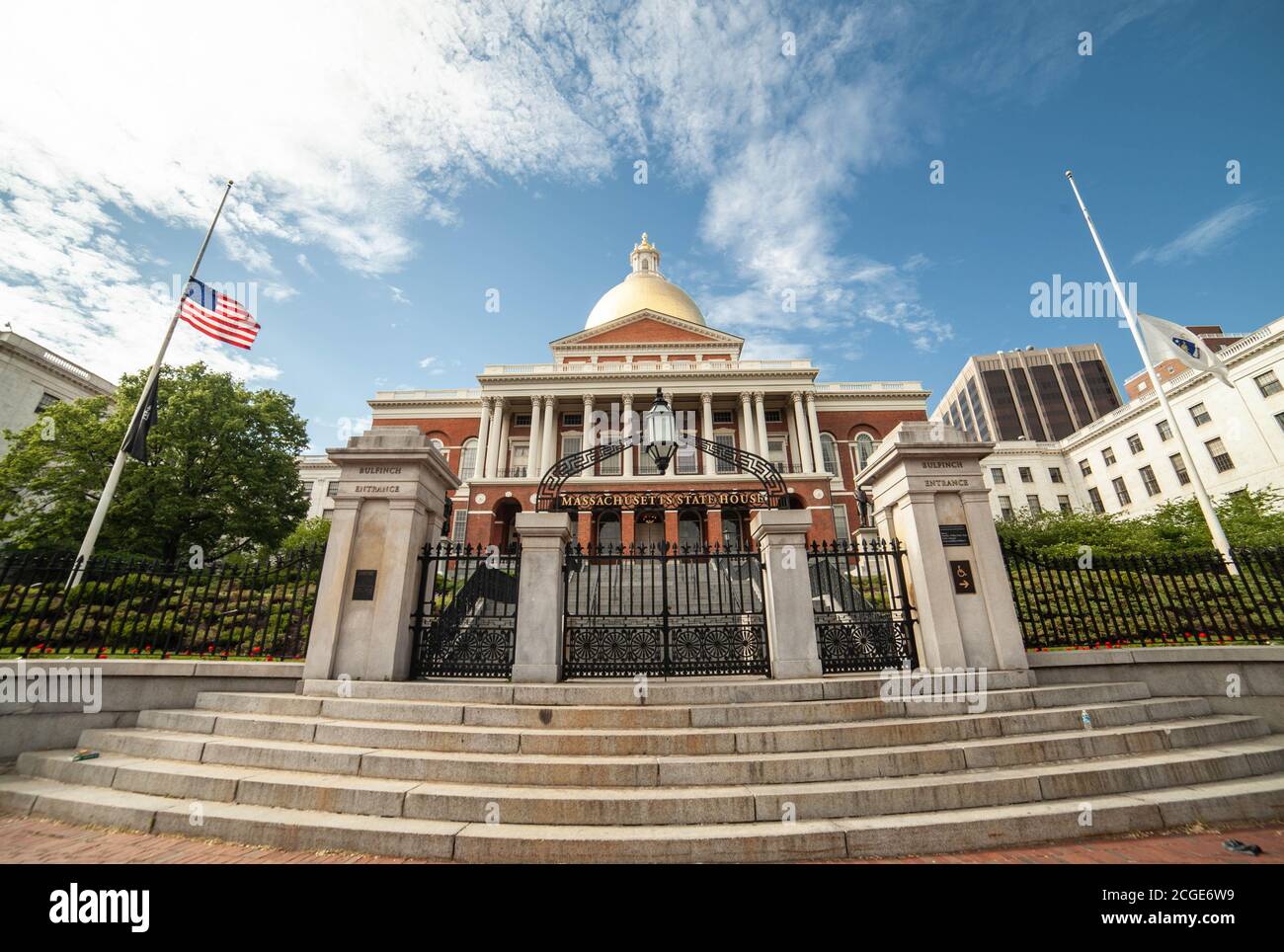 Massachusetts State House - Bulfinch Entrance bottom view on a sunny day; the bright blue skies with white clouds on the background. Stock Photo
