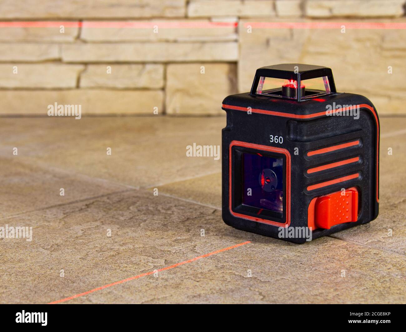 The Red Light Beams Of The Laser Level Device On The Wall And Floor Show The Direction Stock Photo Alamy