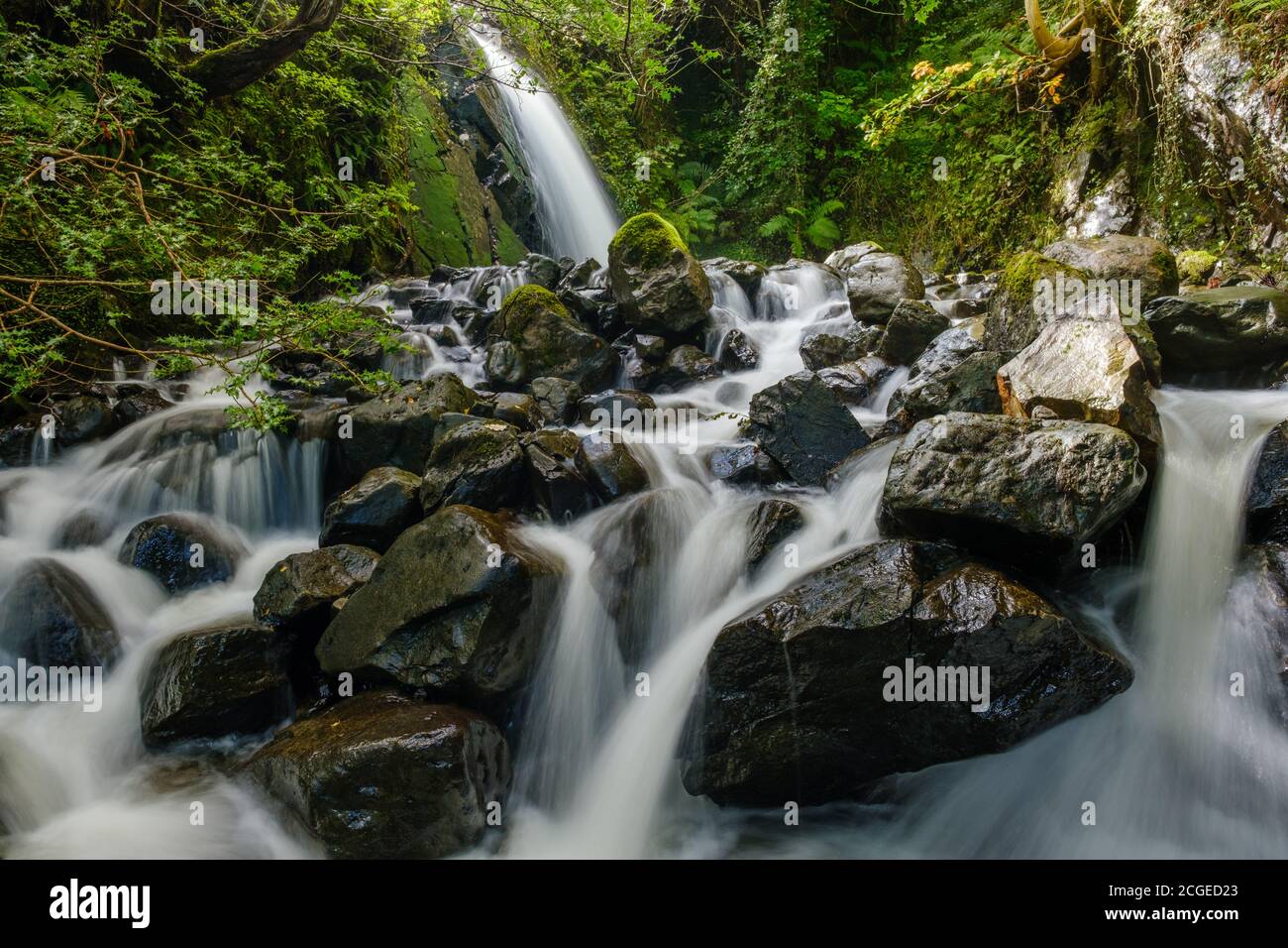 Small waterfalls cascading down Hause Gill from Honister Hause, Lake District, UK Stock Photo