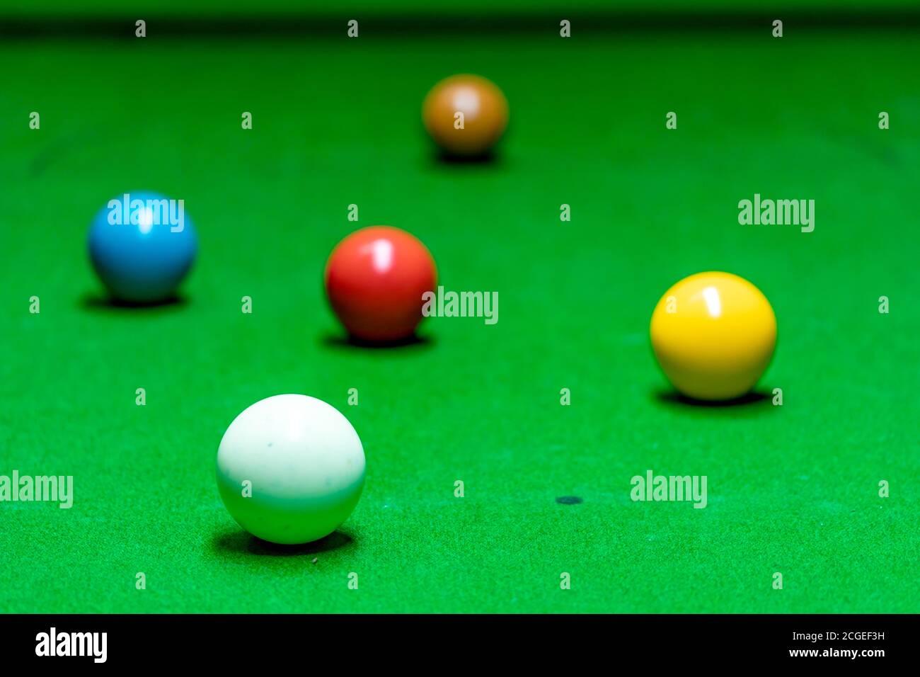 Different colored snooker balls scattered on the snooker table Stock