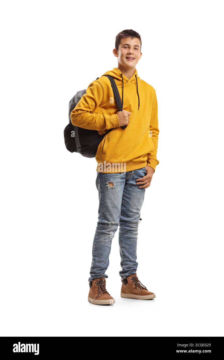Full length portrait of a male teenage student in a yellow hoodie and a backpack smiling at the camera isolated on white background Stock Photo