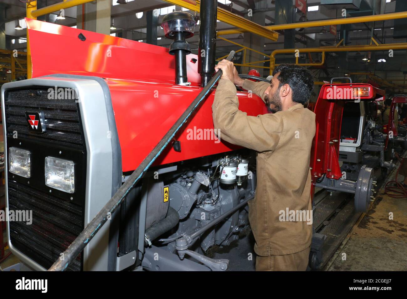 Millat Implement assembly stage the body of millat tractor at factory and tractor parts ...