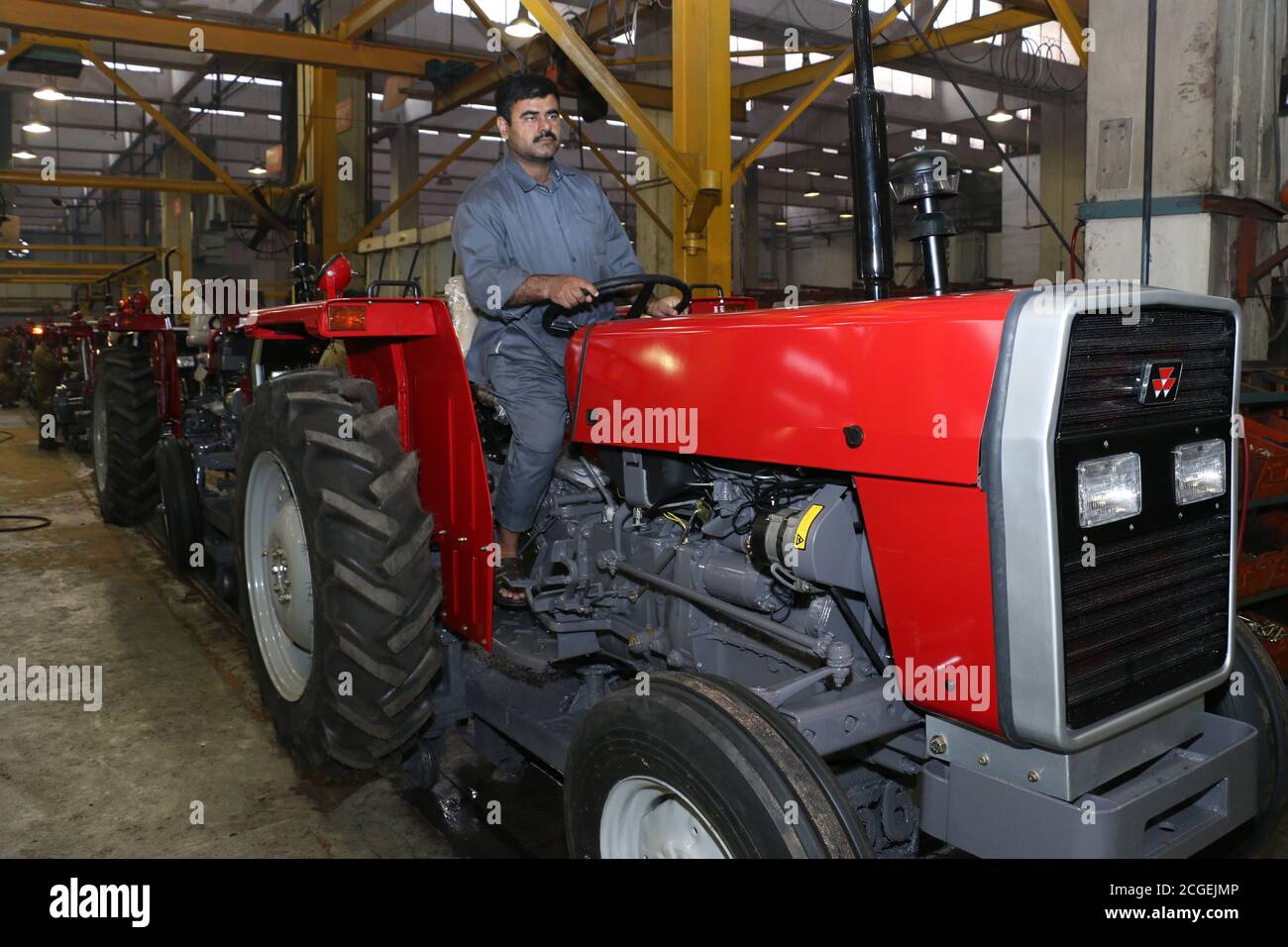 assembly stage the body of millat tractor at factory and tractor parts