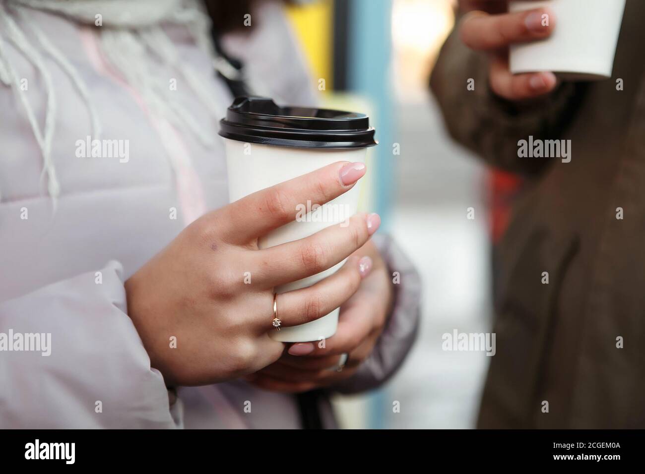 woman holding coffee cup drink to go autumn fall season Stock Photo
