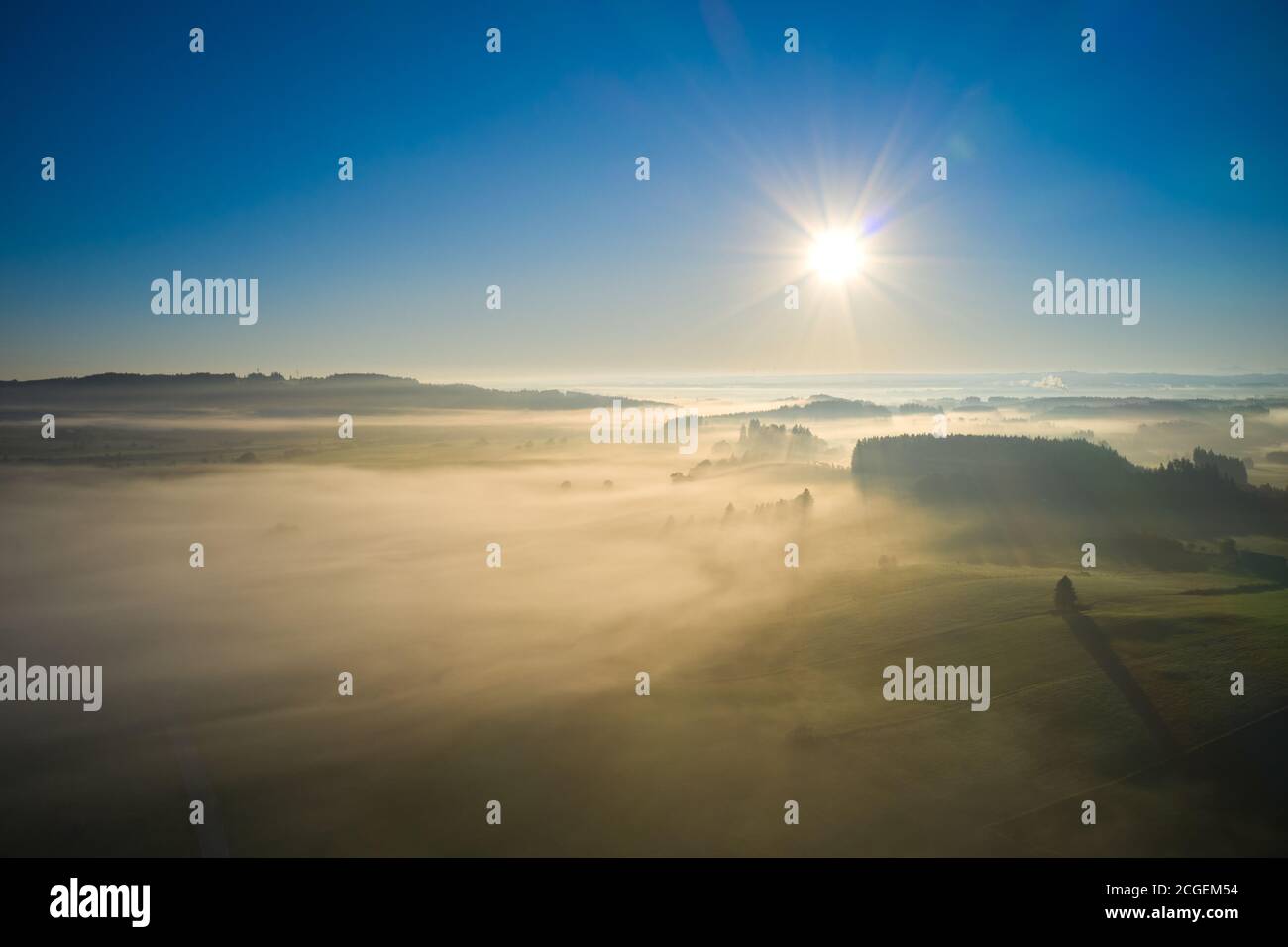 Bavarian landscape in front of the Alps with fog in the morning, short after sunrise in Marktoberdorf, Germany, 9th September, 2020.  © Peter Schatz / Alamy Live News Stock Photo