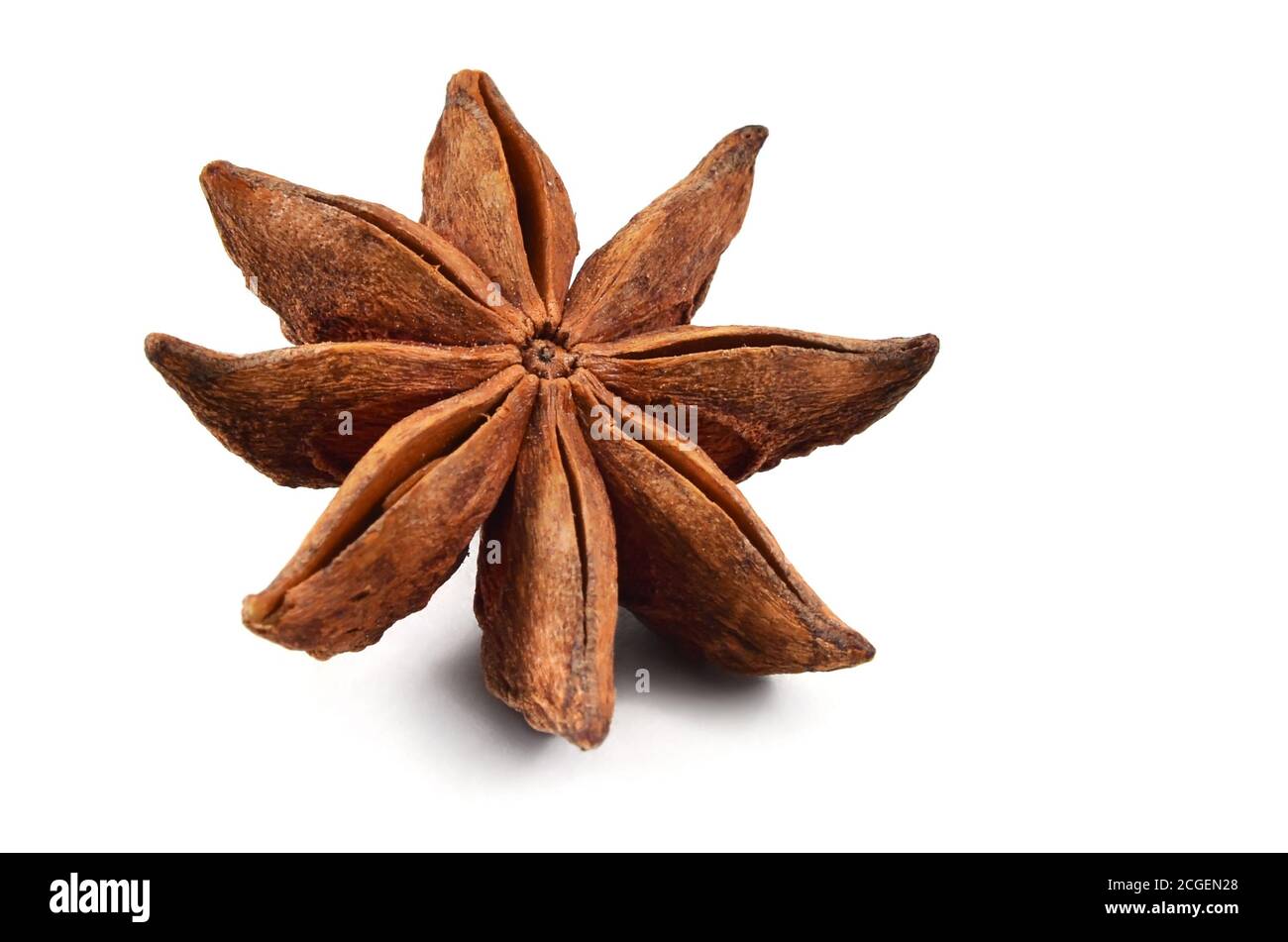 Spice. Badian or star-anise on a white background. Isolated, closeup. Stock Photo