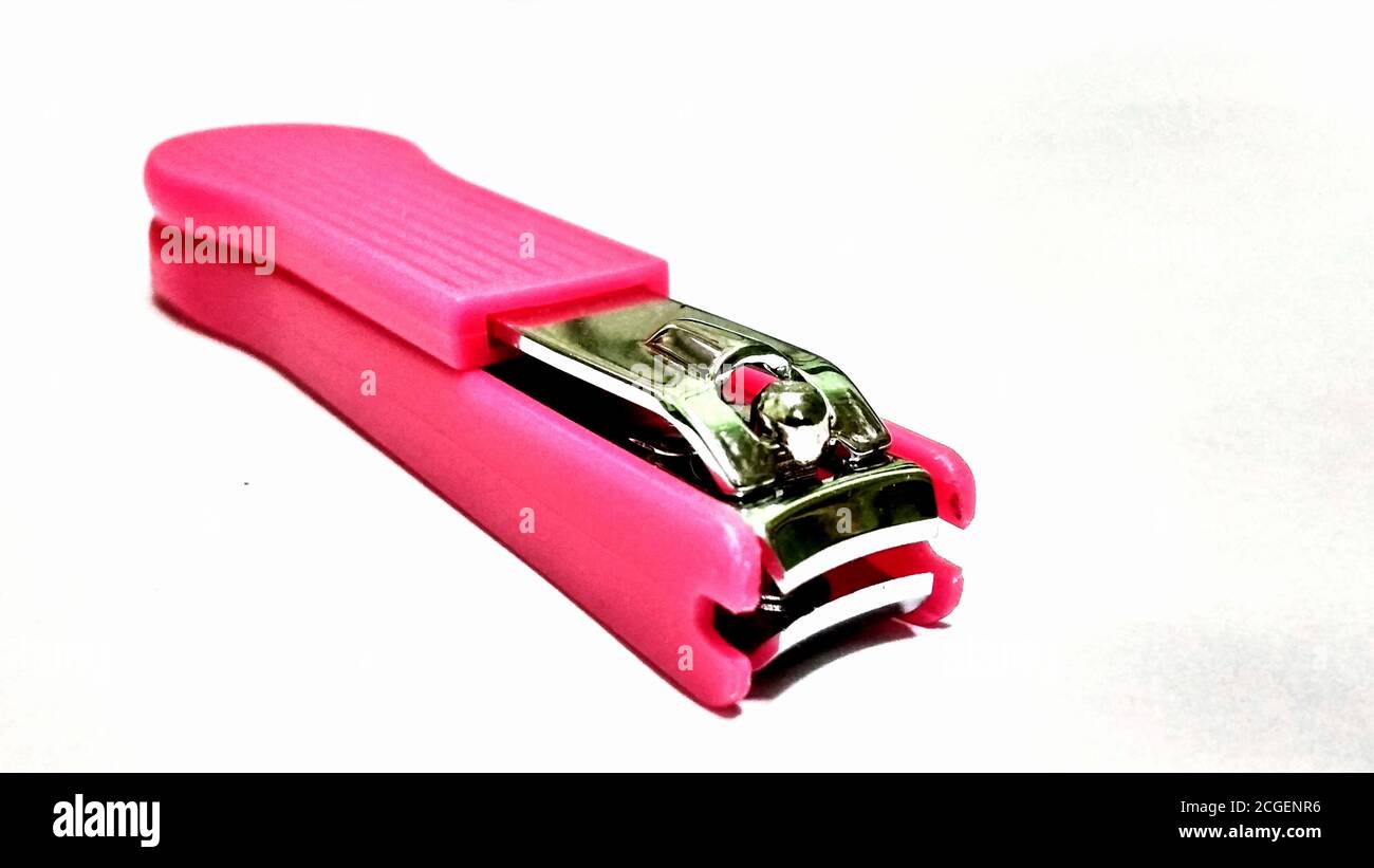 A pink nail clipper on white background Stock Photo
