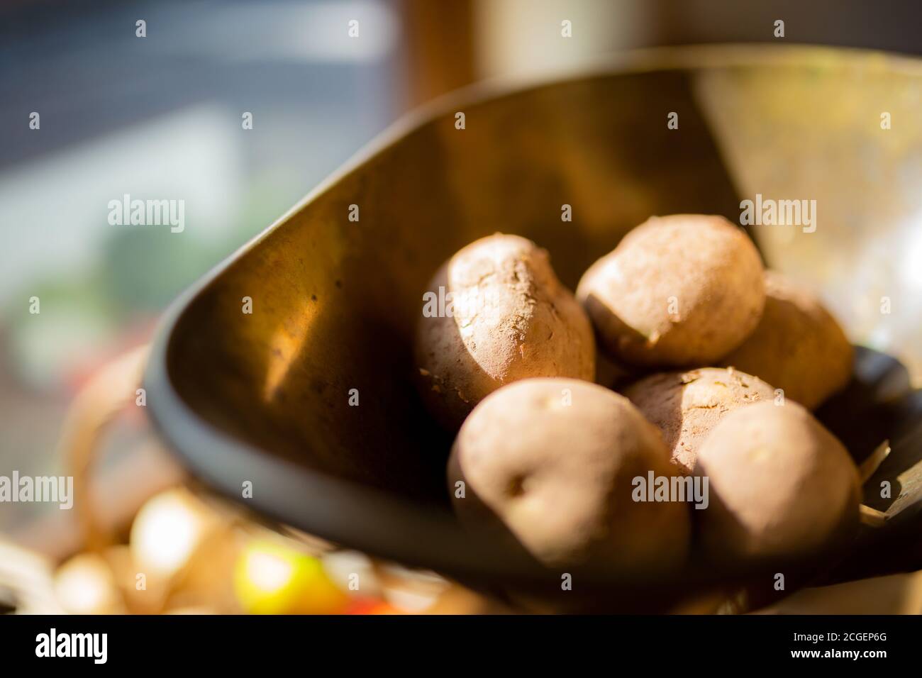 Potatoes on a scale in an old fashioned vegetable shop in UK Stock Photo