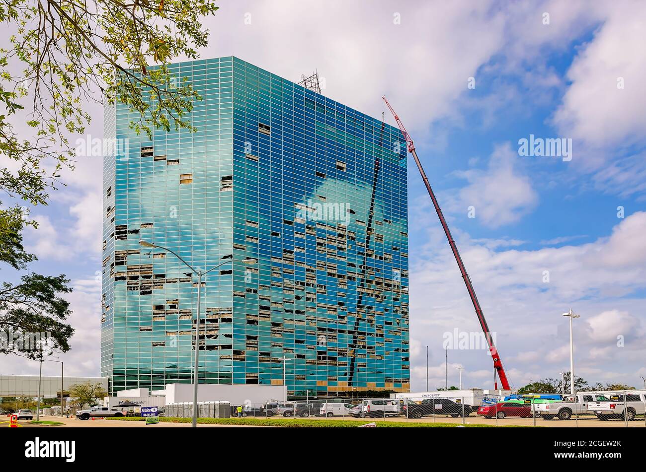 Debris is removed from the Capital One Tower, Sept. 9, 2020, in Lake Charles, Louisiana. The skyscraper was damaged during Hurricane Laura. Stock Photo
