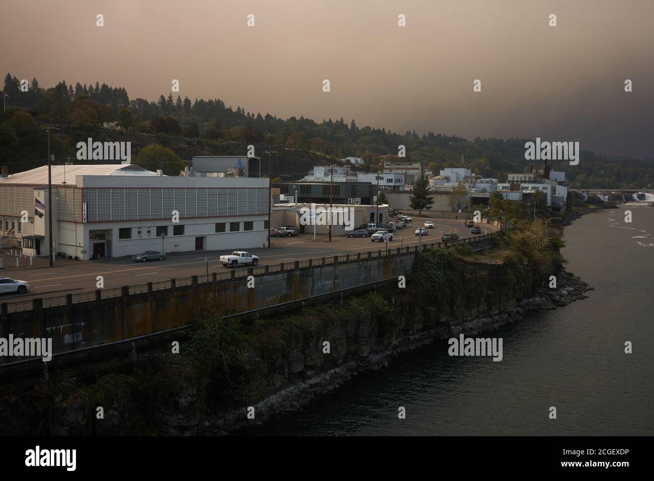 Dark sky with smokes from wildfires in Riverside and Beachie Creek in the distance, seen from Oregon City Bridge over Willamette River in the morning. Stock Photo