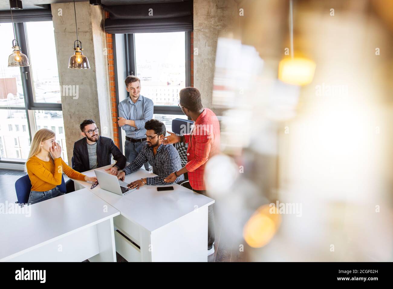 Big company Top managers attending business session of a professional coach trainer at big studio interior Stock Photo