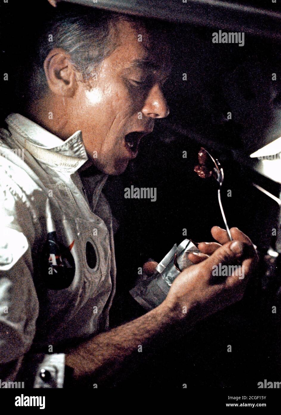 (7-19 Dec. 1972) --- A fellow crewman took this photograph of astronaut Eugene A. Cernan eating a meal under weightlessness conditions of space during the final lunar landing mission in NASA's Apollo program. Stock Photo