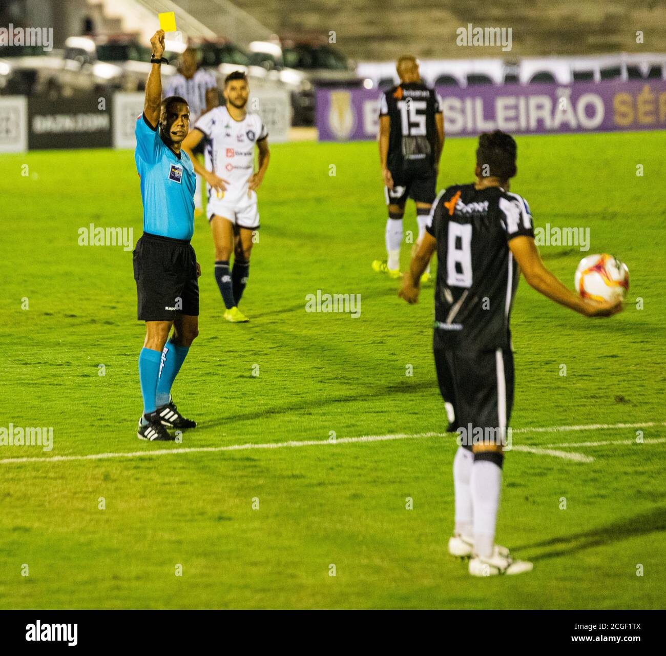 Campina Grande, Brazil. 10th Sep, 2020. Referee Luiz Sobral presents a yellow card to Vinícius Barba do Treze during a match between Treze and Remo, valid for the 5th round of the Brazilian Championship C series, held this Thursday (10th) night at the Governador Ernani Sátyro Stadium in Campina Grande, Paraíba. Credit: Daniel Lins/FotoArena/Alamy Live News Stock Photo