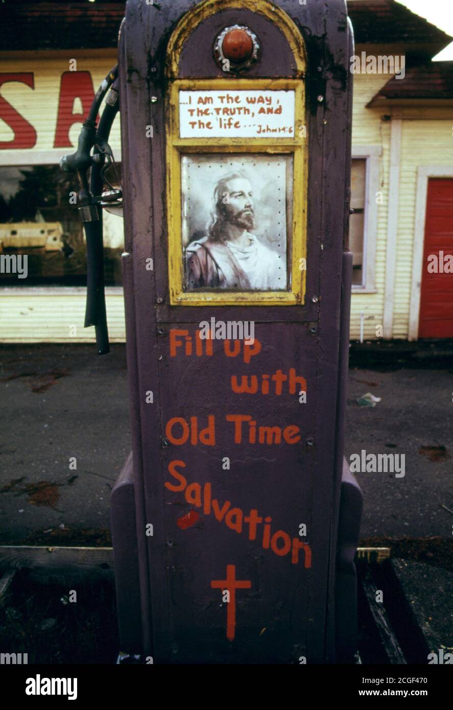 Gasoline Stations Abandoned During the Fuel Crisis in the Winter of 1973-74 Were Sometimes Used for Other Purposes. This Station at Potlatch, Washington, West of Olympia Was Turned Into a Religious Meeting Hall. A Sign Painted on the Gas Pump Proclaimed 'Fill Up with Old Time Salvation.' 04/1974 Stock Photo