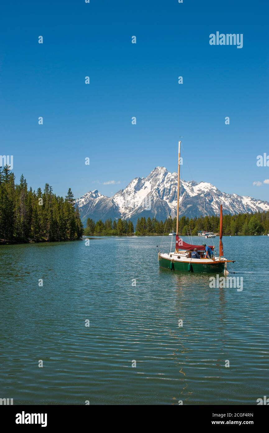 A sailboat in Colter Bay on Jackson Lake in the Grand Teton National Park, Wyoming, United States. Stock Photo