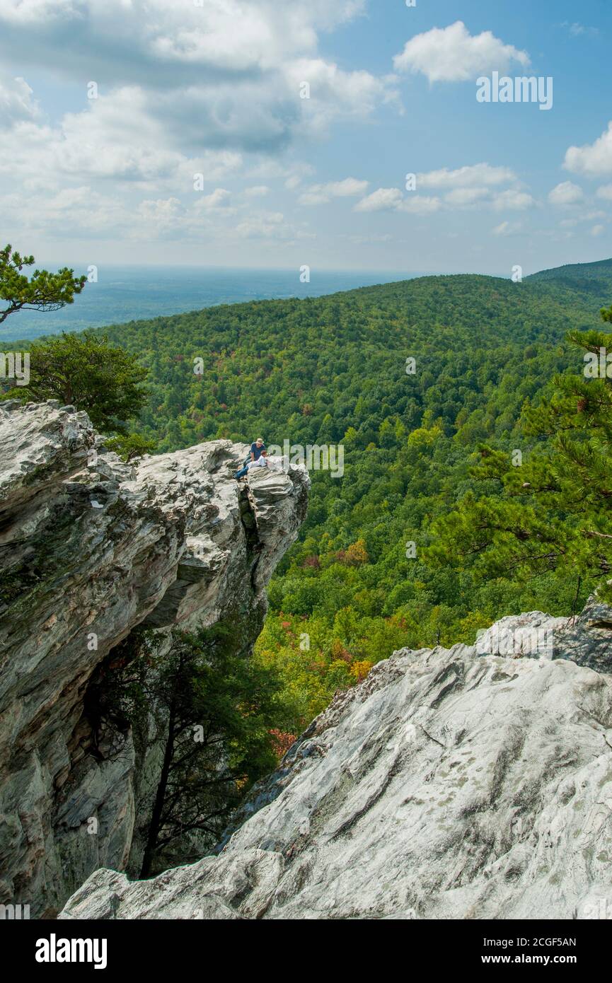 A hiker on the Hanging Rock in the Hanging Rock State Park in Stokes County, near Winston-Salem in North Carolina, USA. Stock Photo