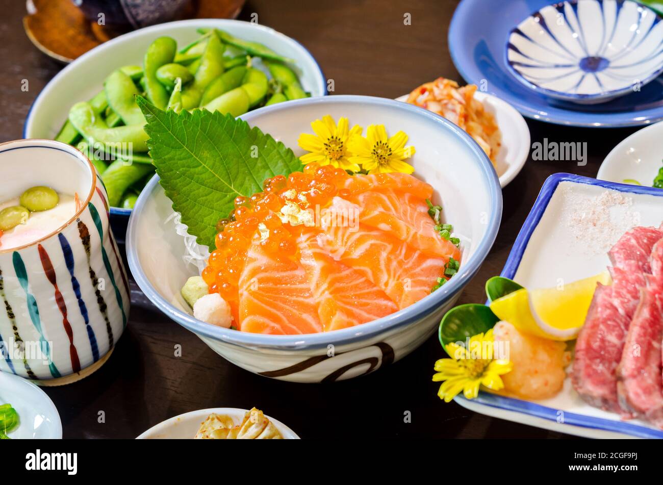 Salmon sashimi with salmon's egg (Ikura) in bowl at Japanese food