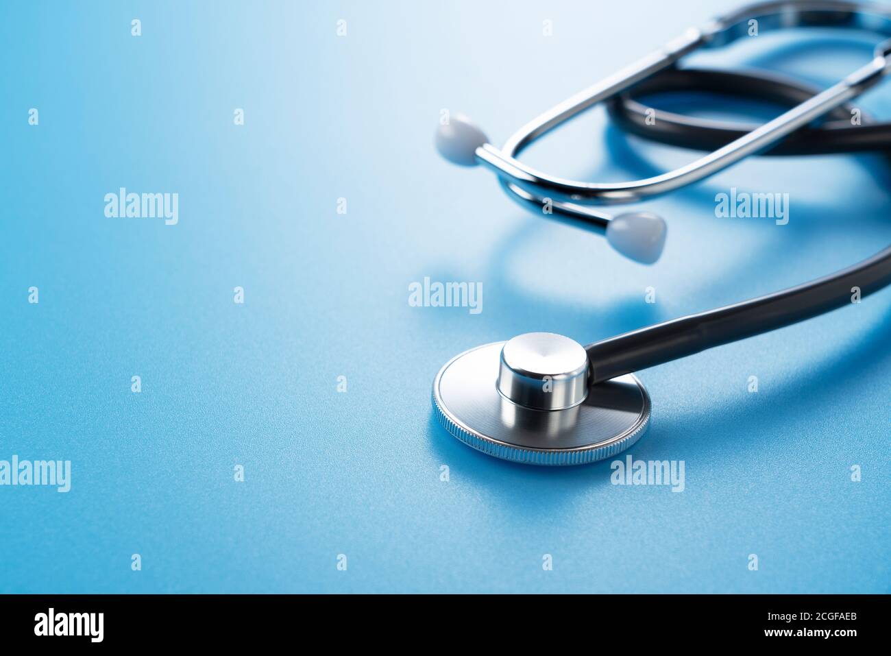 Stethoscope on a blue background with space Stock Photo - Alamy