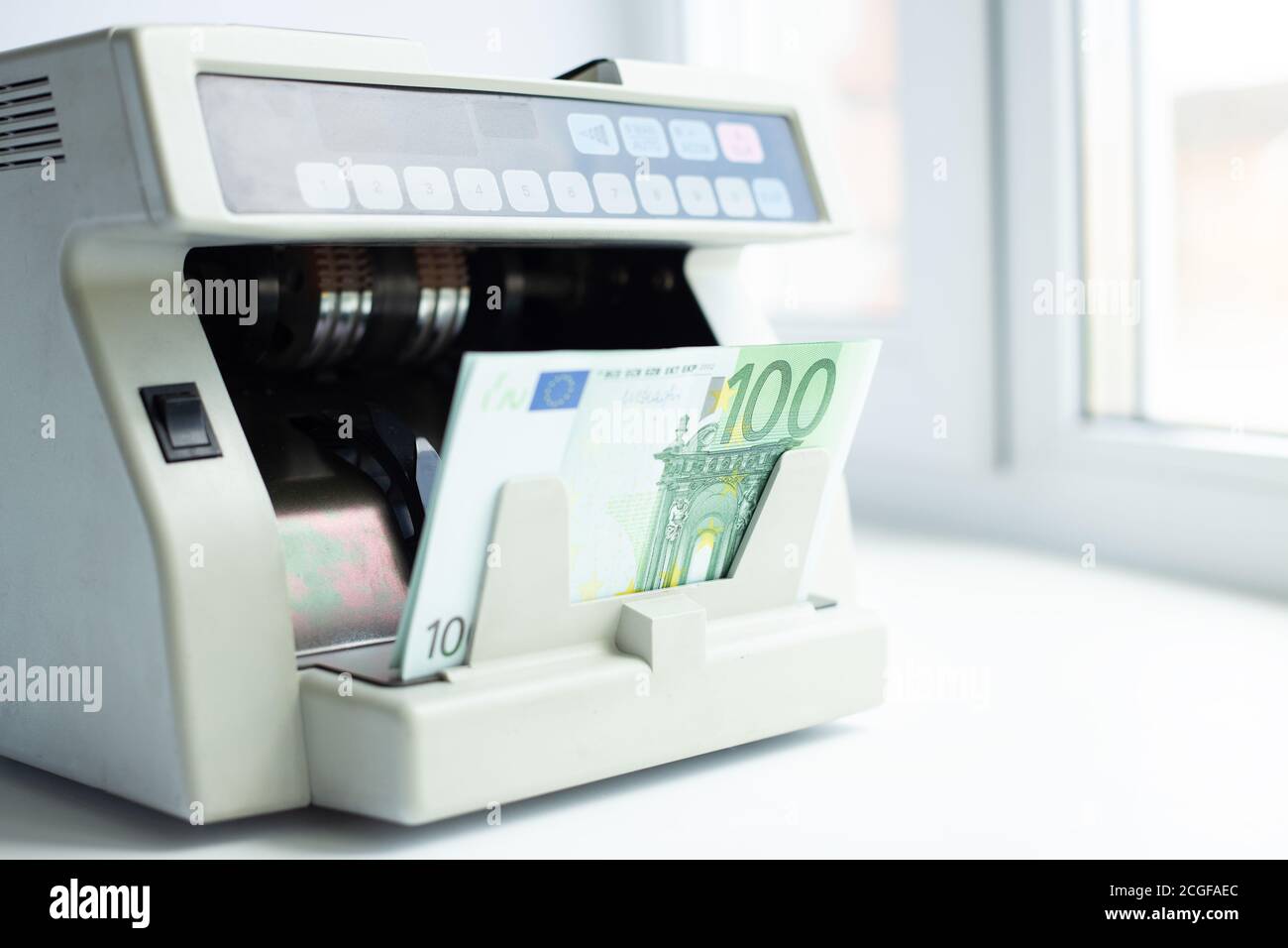 Electronic money counter machine is counting the euro banknotes
