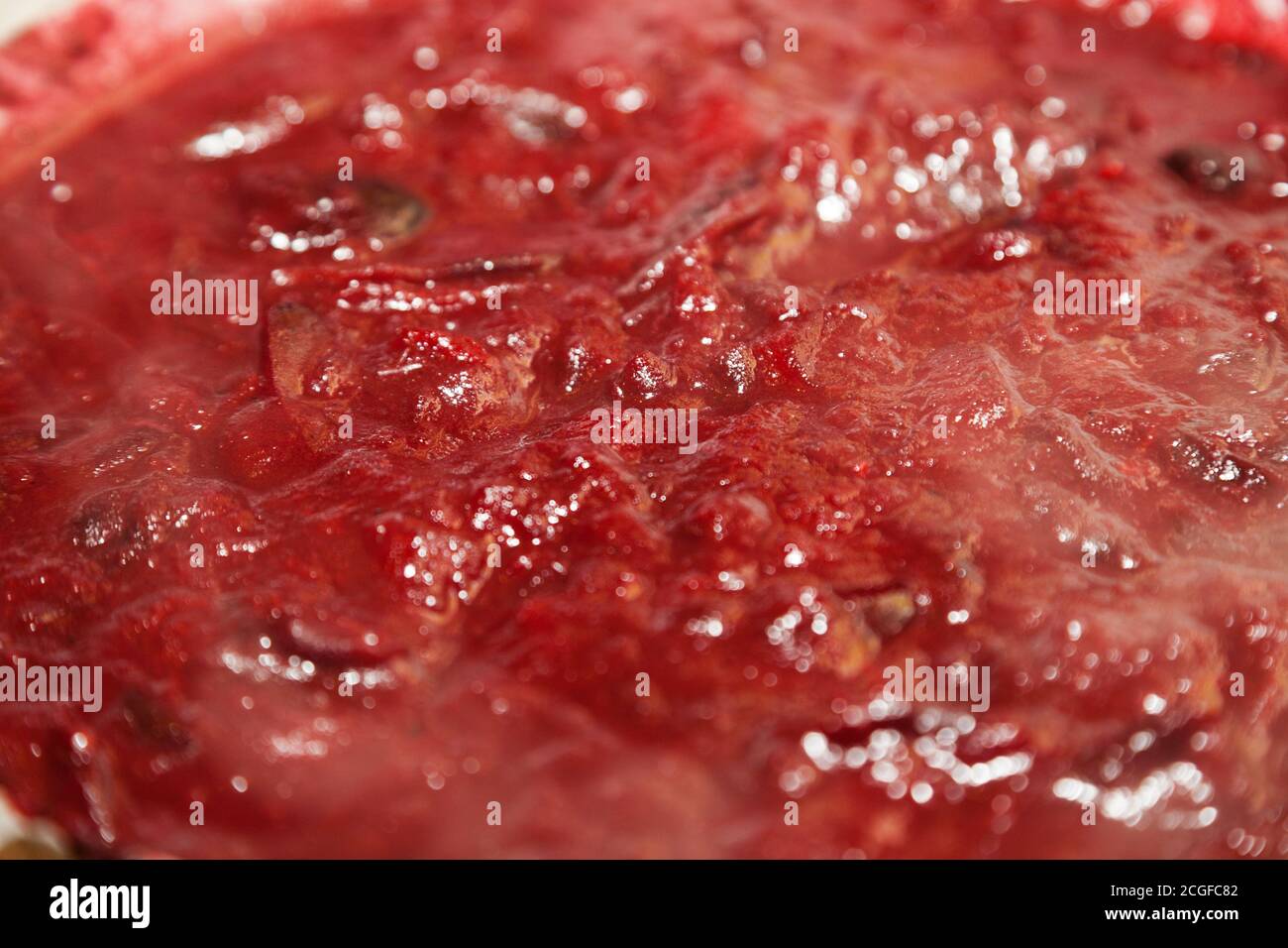 Closeup of boiling chutney sauce with selective focus Stock Photo