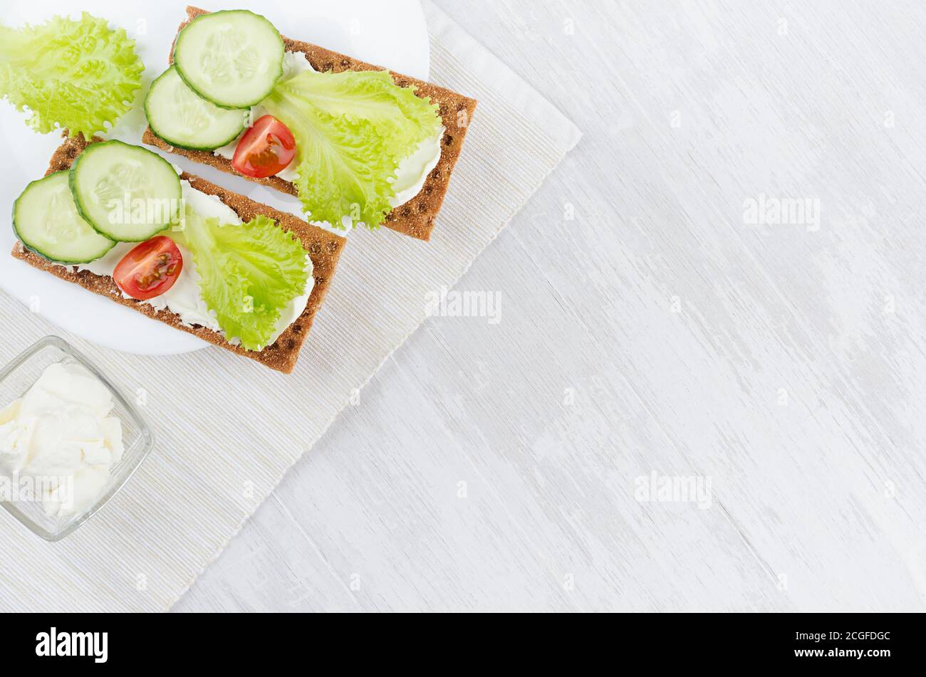 Fresh summer healthy appetizer of whole grain rye crisps breads with