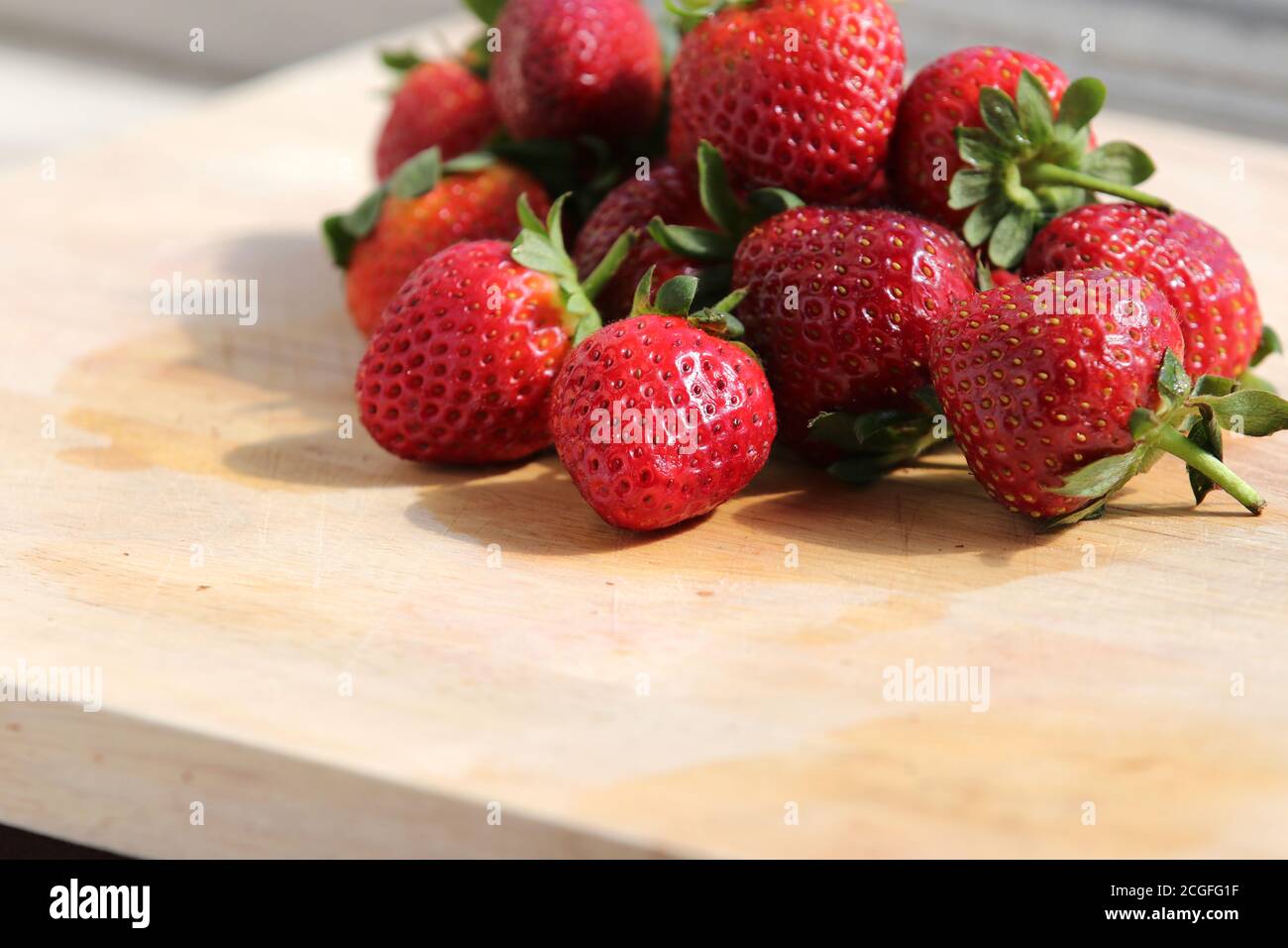 Group of people eating strawberries hi-res stock photography and images ...