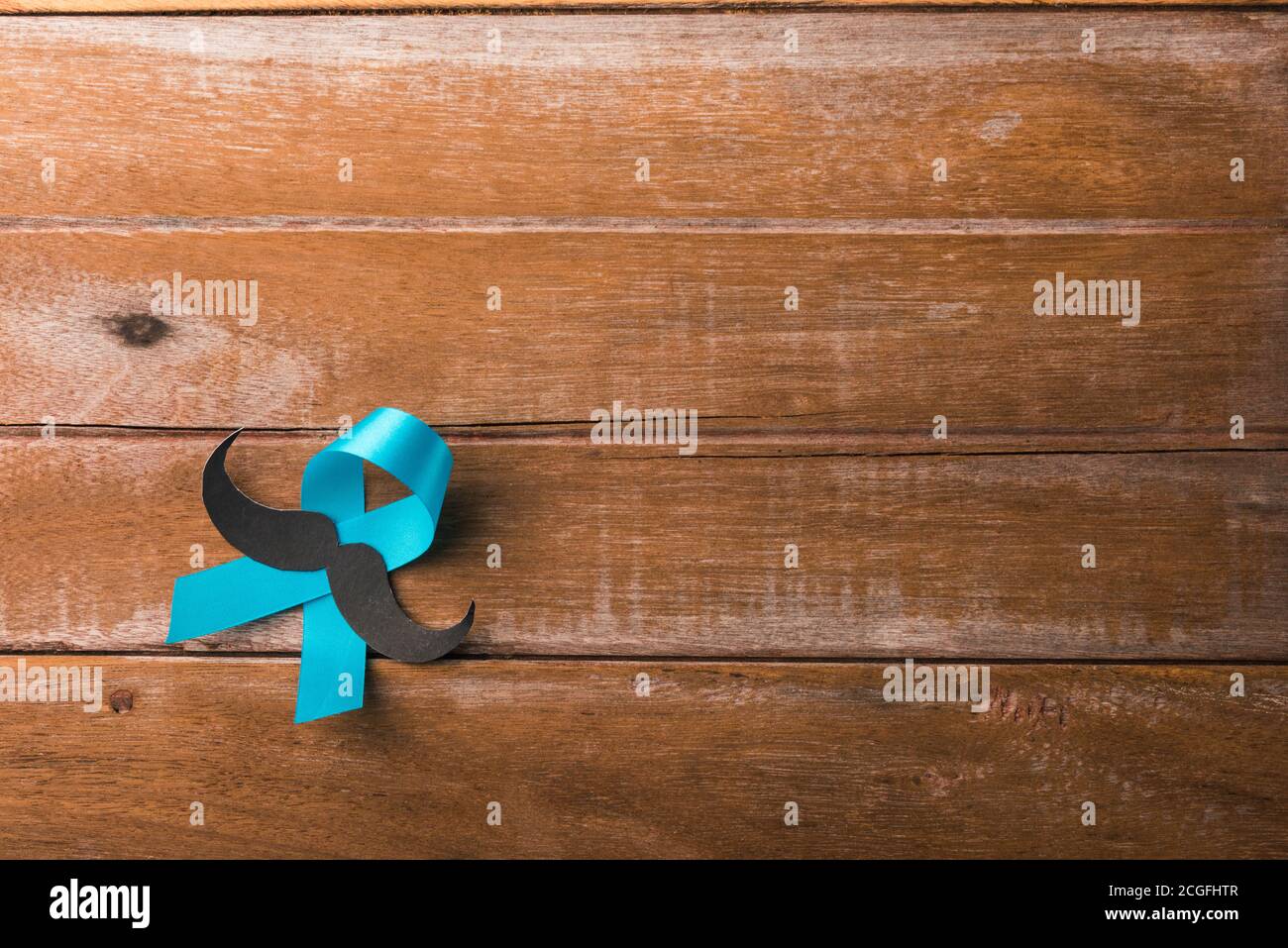 November Blue, Light blue ribbon with a man mustache on wooden ...