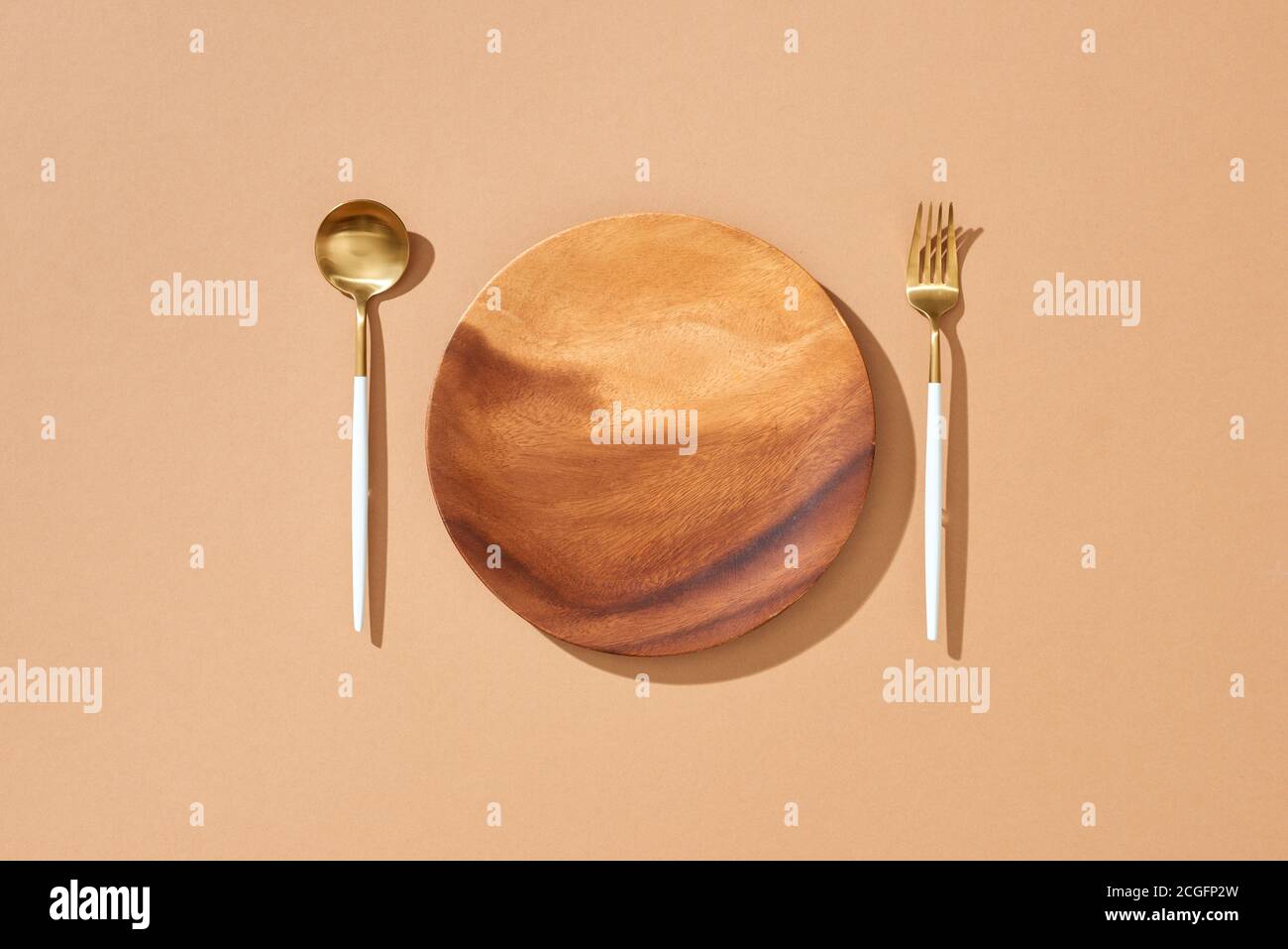 Knife, Fork and plate on table isolated Stock Photo - Alamy
