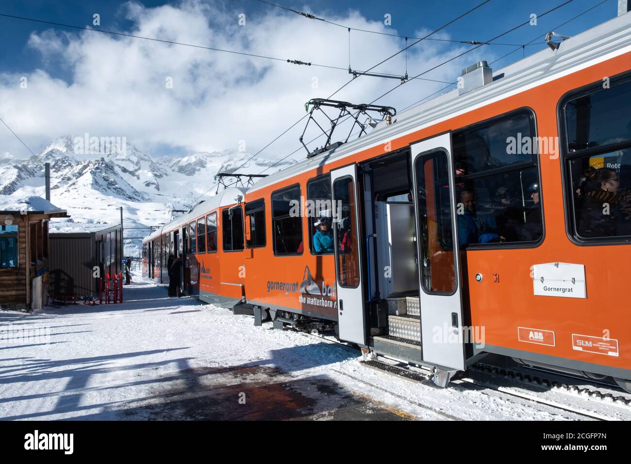 Zermatt, Switzerland - Feb 19 2020: The Gornergrat train in winter, popular among skiers. It is the highest cogwheel train in Europe. Stock Photo